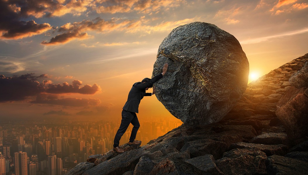 Business man pushing large stone up to hill , Business heavy tasks and problems concept._副本.jpg